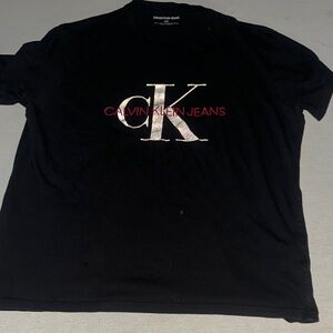 Mens Size Large Calvin Klein Black Tee with Silver and Red Logo.
